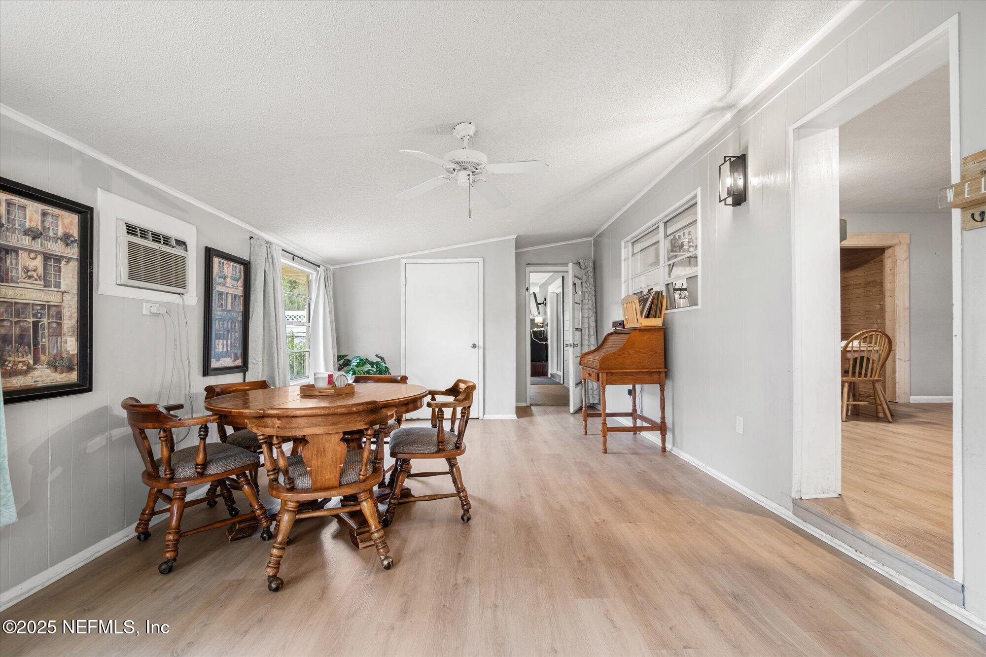 2025 Kate Street Palatka, FL 32177 - Photo 15 of 36 a view of a dining room with furniture and chandelier