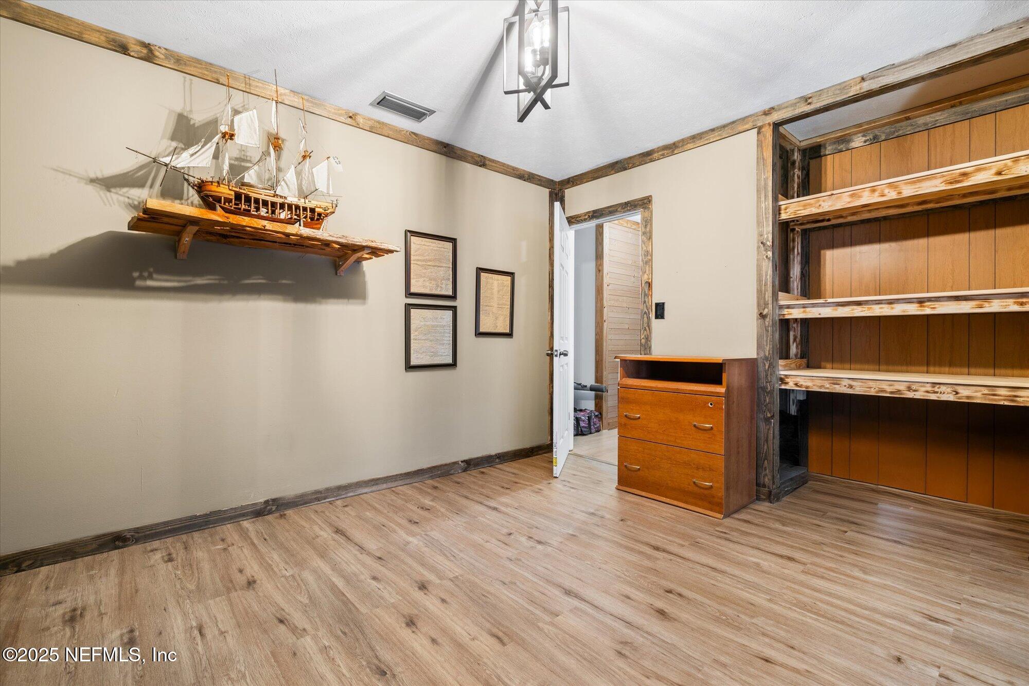 2025 Kate Street Palatka, FL 32177 - Photo 20 of 36 a view of a room with wooden floor and staircase