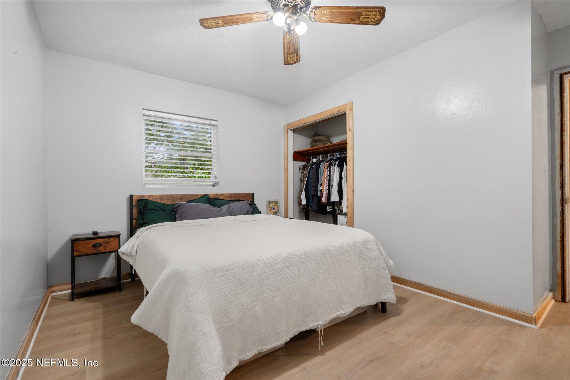 2025 Kate Street Palatka, FL 32177 - Photo 22 of 36 a large bed sitting in a bedroom next to a window