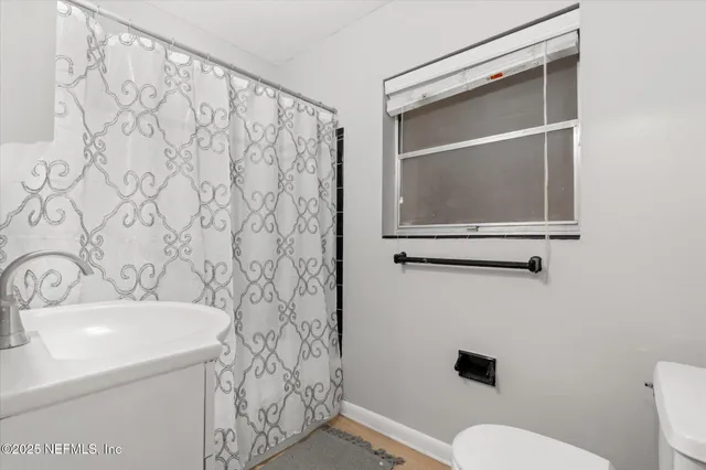 a bathroom with a sink and a toilet