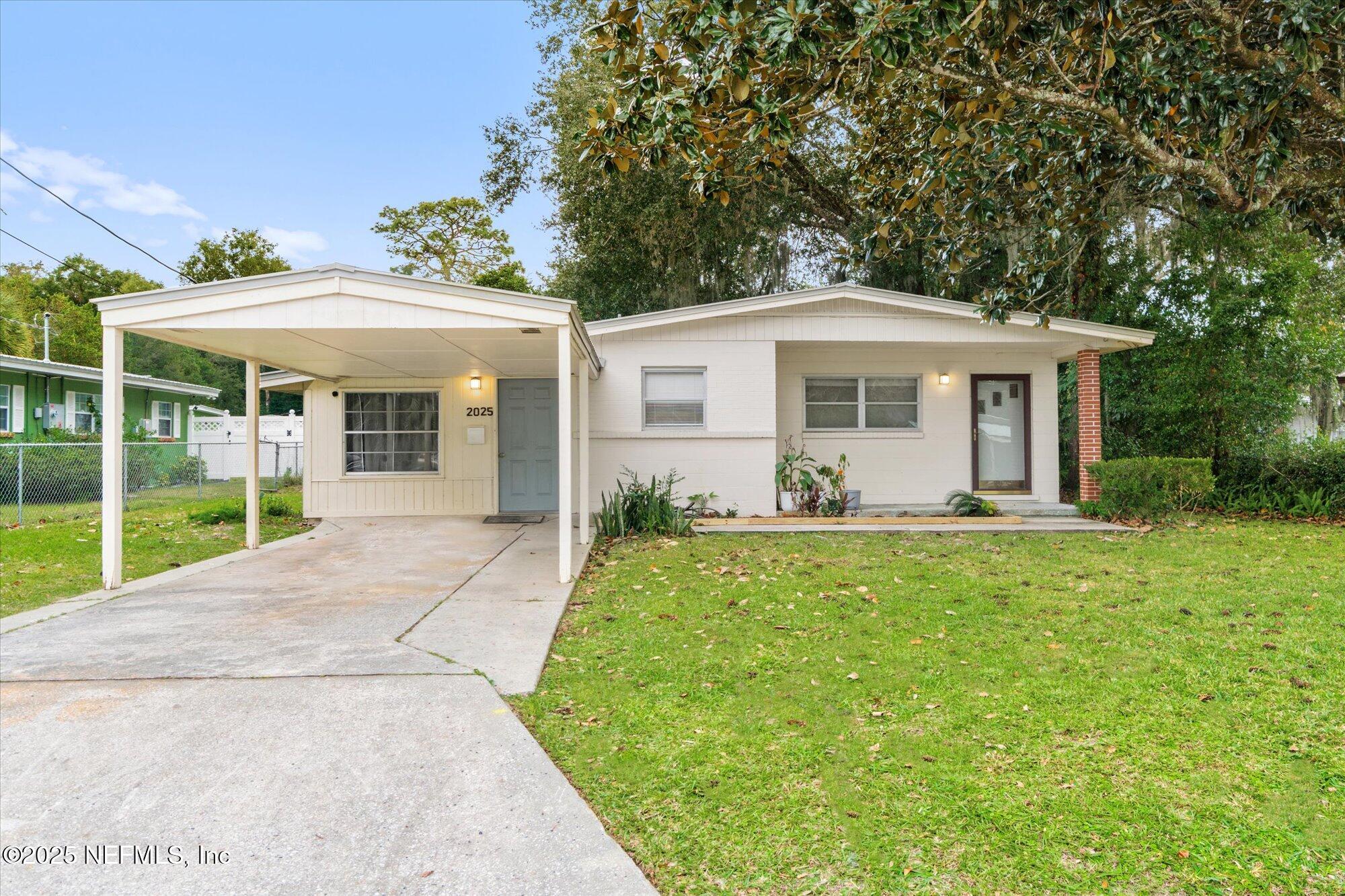 2025 Kate Street Palatka, FL 32177 - Photo 34 of 36 a view of a house with backyard sitting area and garden