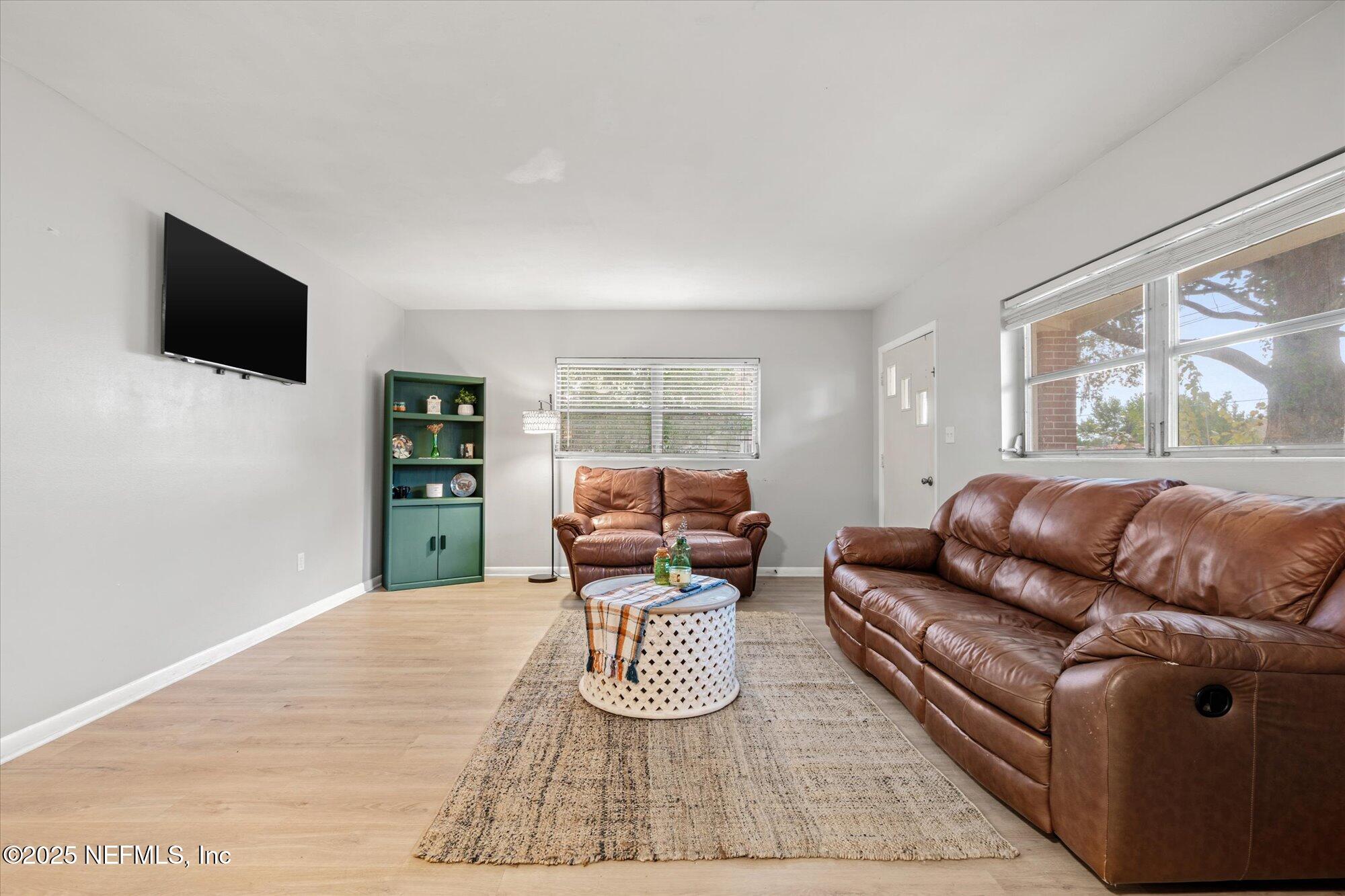 2025 Kate Street Palatka, FL 32177 - Photo 5 of 36 a living room with furniture and a flat screen tv