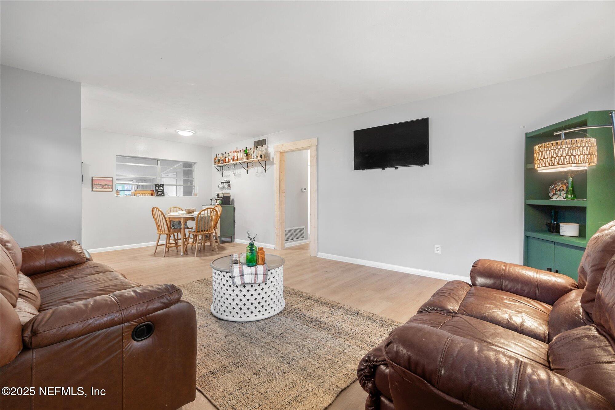 2025 Kate Street Palatka, FL 32177 - Photo 6 of 36 a living room with furniture and a flat screen tv