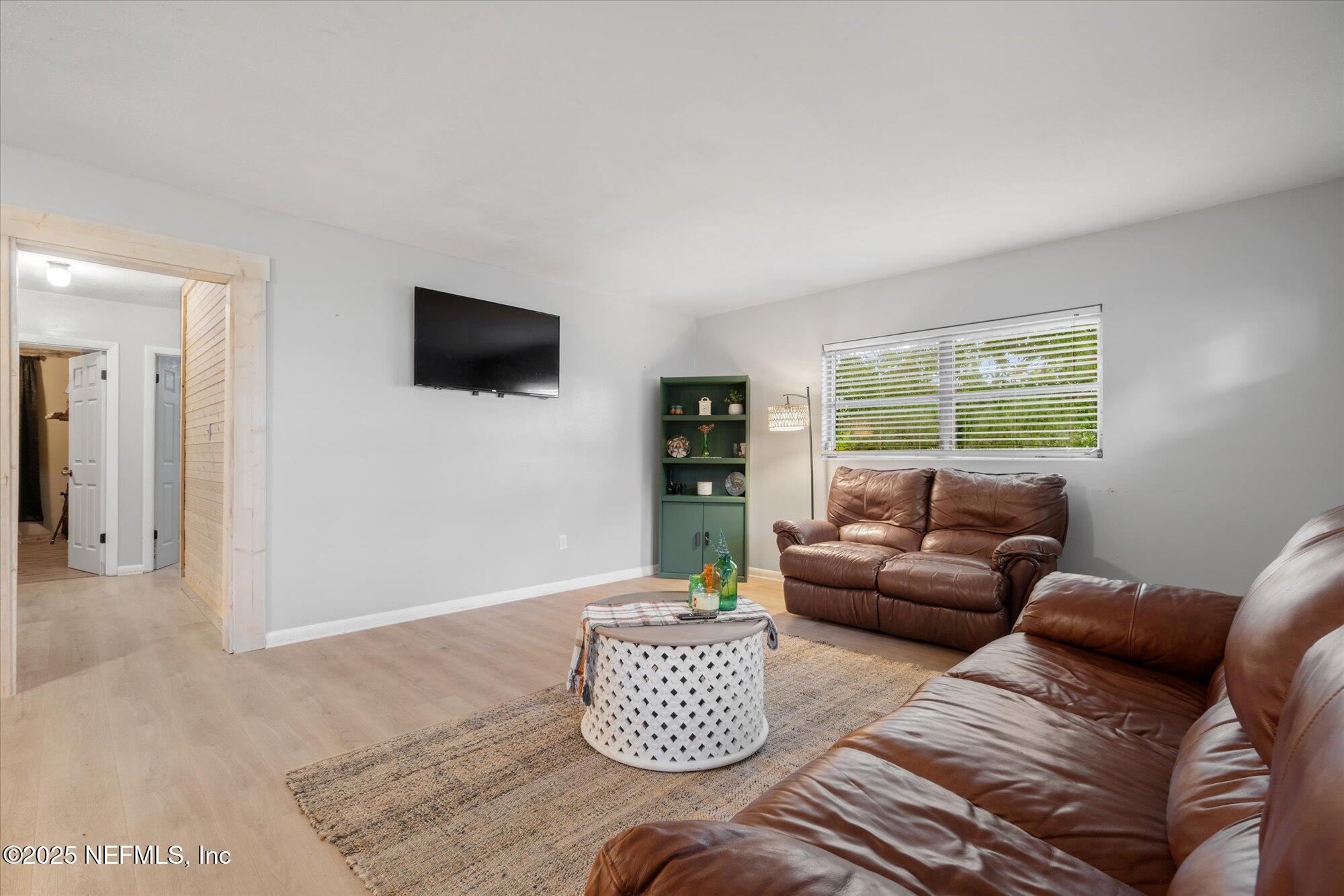 2025 Kate Street Palatka, FL 32177 - Photo 7 of 36 a living room with furniture and a flat screen tv