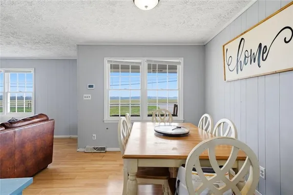 a kitchen with stainless steel appliances granite countertop a sink a stove and a refrigerator