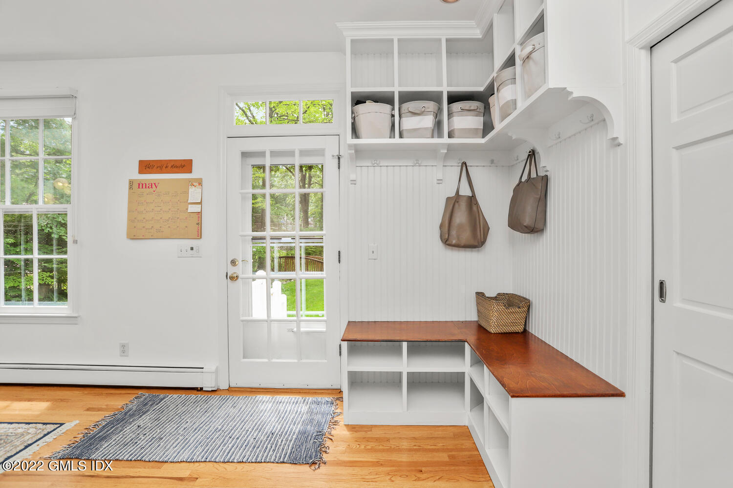 72 Lockwood Road Riverside, CT 06878 - Photo 12 of 23 a view of an entryway with wooden floor and cabinets
