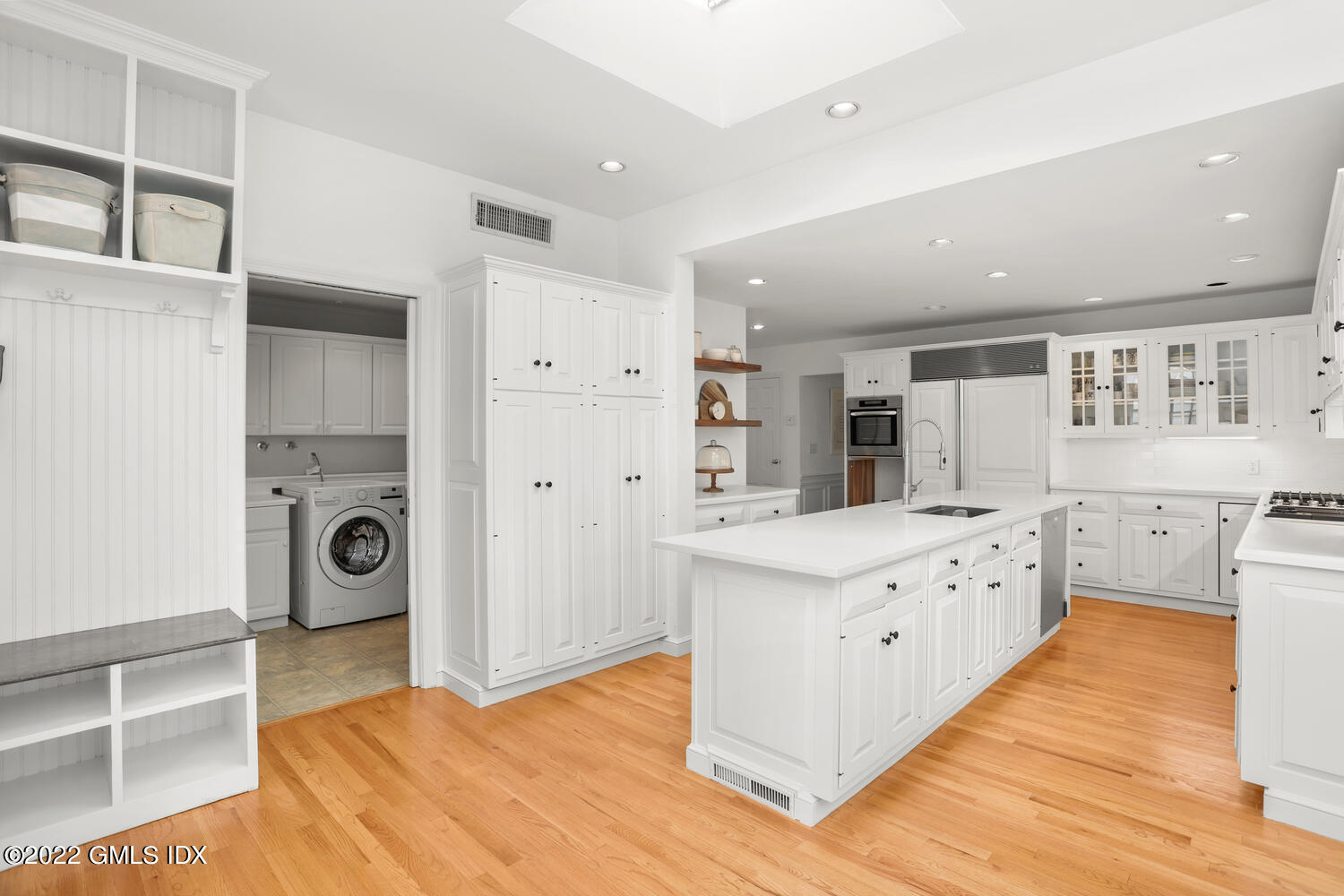 72 Lockwood Road Riverside, CT 06878 - Photo 14 of 23 a large white kitchen with granite countertop a sink and cabinets