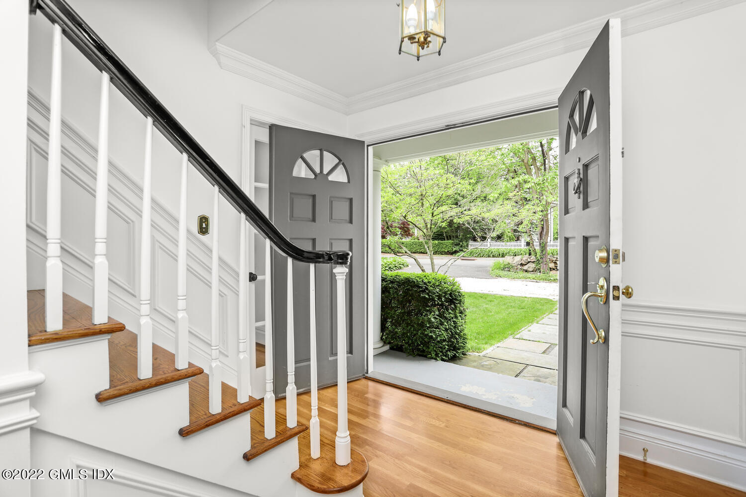 72 Lockwood Road Riverside, CT 06878 - Photo 3 of 23 a view of staircase with open floor to ceiling windows and wooden floor