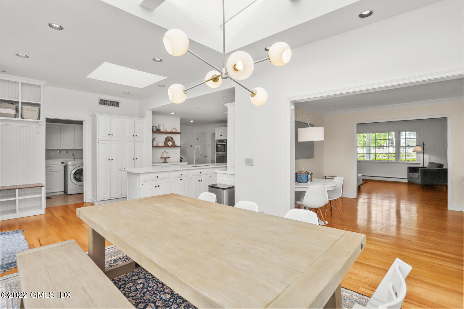 72 Lockwood Road Riverside, CT 06878 - Photo 8 of 23 a large room with kitchen island a chandelier and living room view