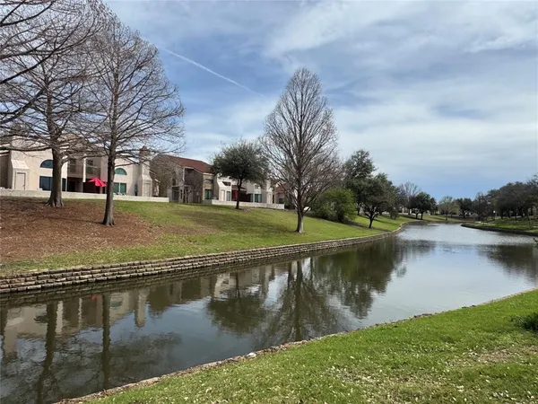 a view of a lake with houses with outdoor space