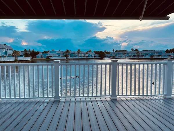 a view of balcony with wooden floor