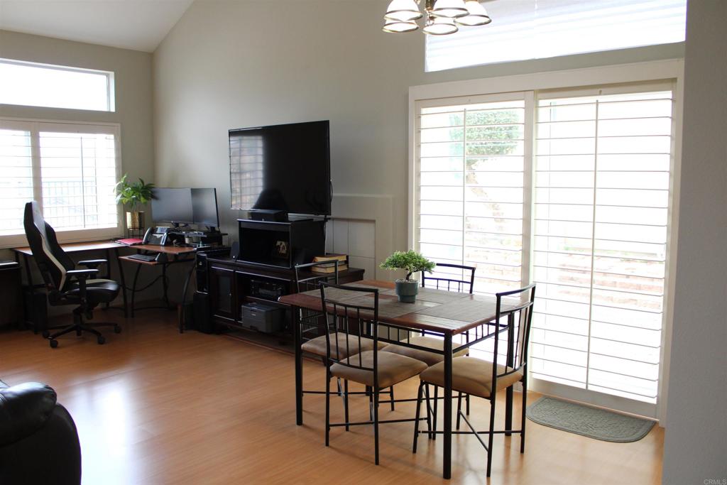 5735 Barbary Place Bonsall, CA 92003 - Photo 11 of 28 a view of a dining room with furniture and a window