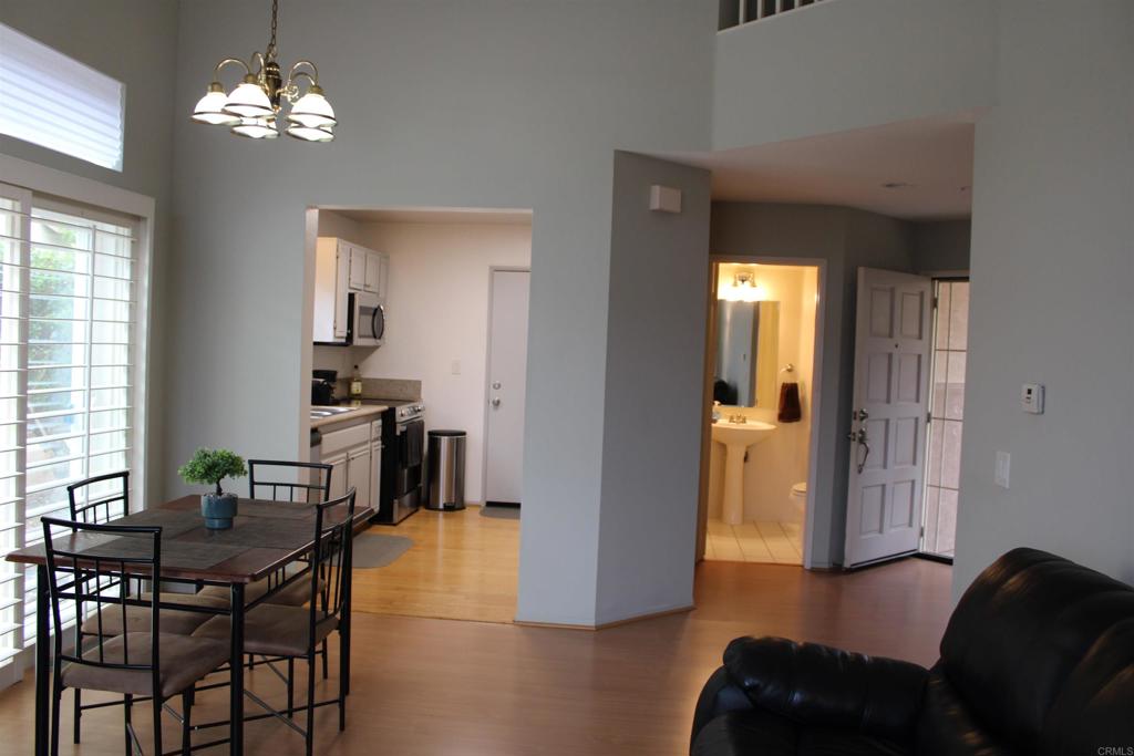 5735 Barbary Place Bonsall, CA 92003 - Photo 12 of 28 a view of a livingroom with furniture and windows