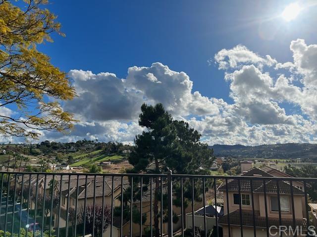 5735 Barbary Place Bonsall, CA 92003 - Photo 8 of 28 a view of a balcony with wooden floor