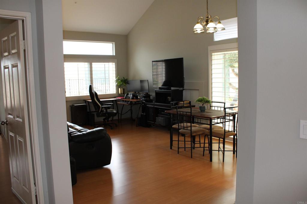 5735 Barbary Place Bonsall, CA 92003 - Photo 10 of 28 a view of a livingroom with furniture window and wooden floor