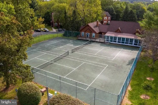 a view of a house with a yard and sitting area