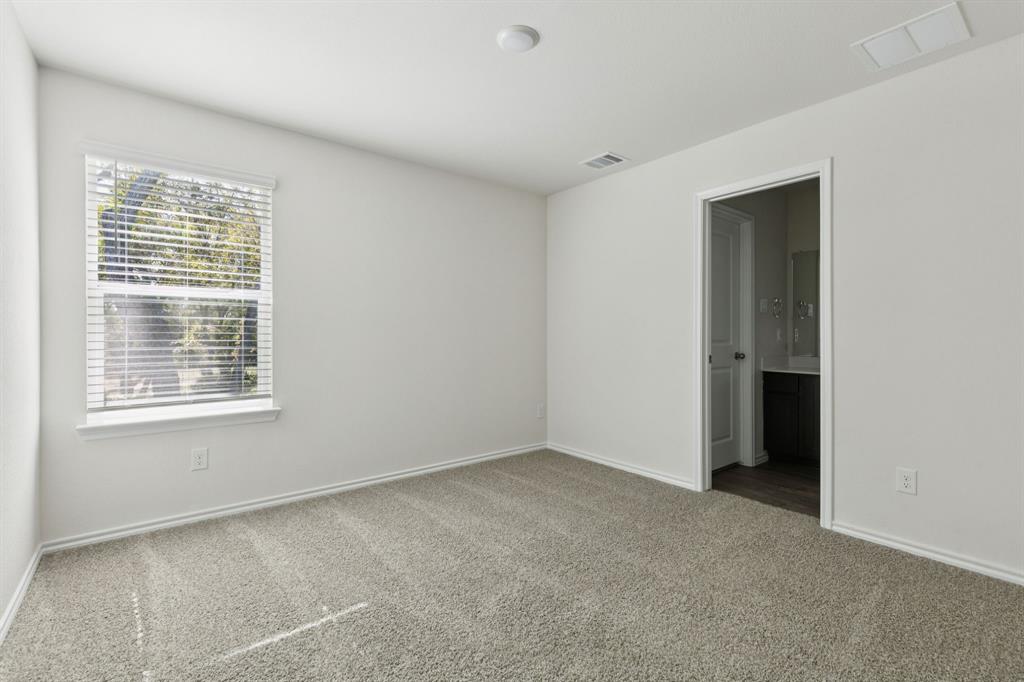 317 Clematis Street Princeton, TX 75407 - Photo 16 of 38 Spare room with carpet floors and baseboards
