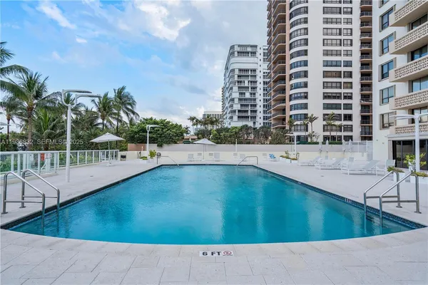 a view of a swimming pool with a terrace