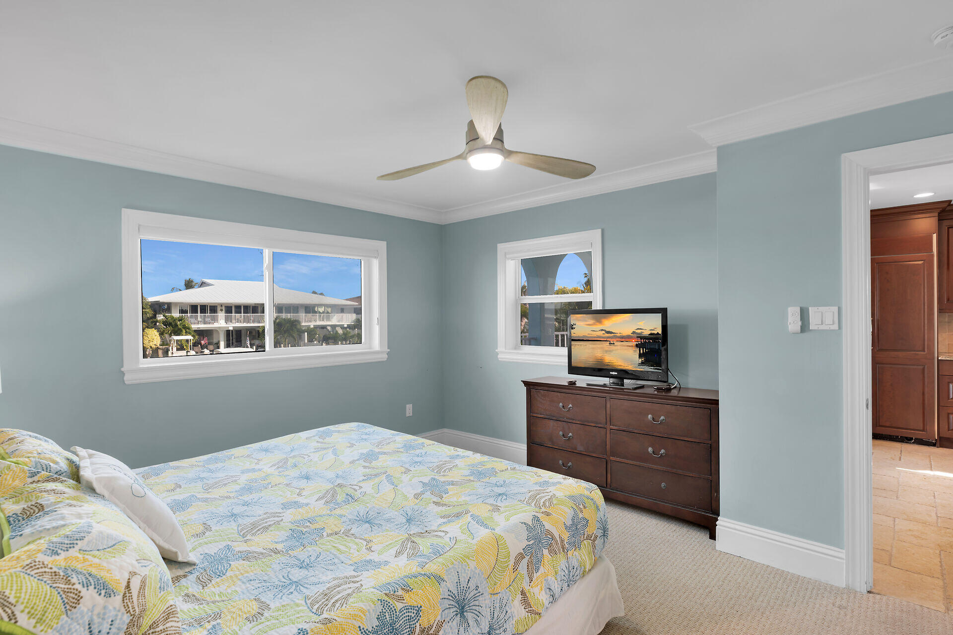 580-590 10th Street Key Colony Beach, FL 33051 - Photo 54 of 75 a bedroom with a bed and a tv on the dresser