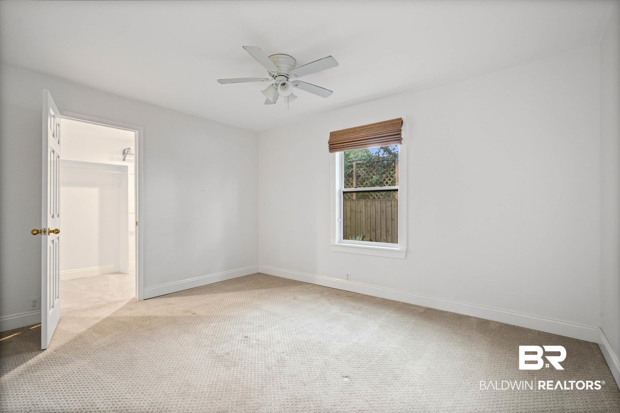 11 York Place Mobile, AL 36608 - Photo 11 of 24 Spare room with light carpet and a ceiling fan