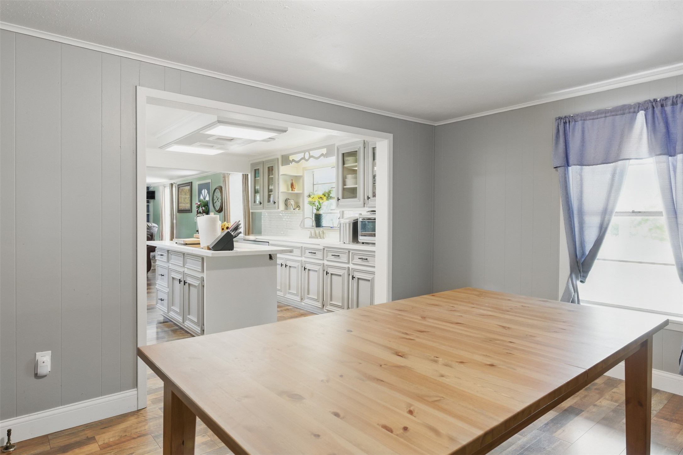 25371 Kickapoo Road Hockley, TX 77447 - Photo 19 of 46 a open kitchen with kitchen island a sink stove and wooden floor