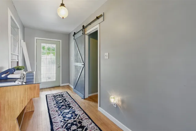 a living room with furniture and a rug