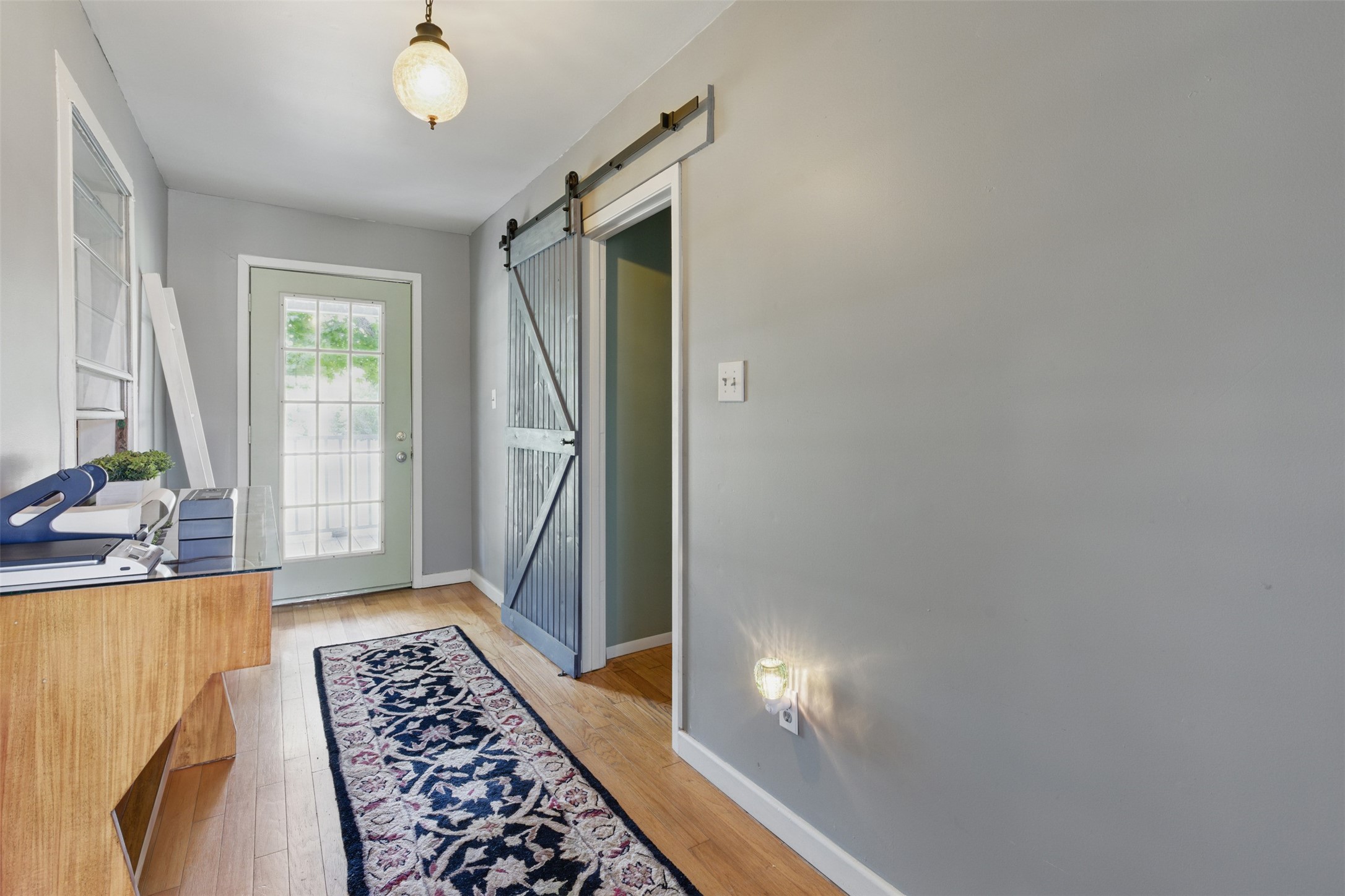 25371 Kickapoo Road Hockley, TX 77447 - Photo 20 of 46 a view of a bedroom with wooden floor and windows