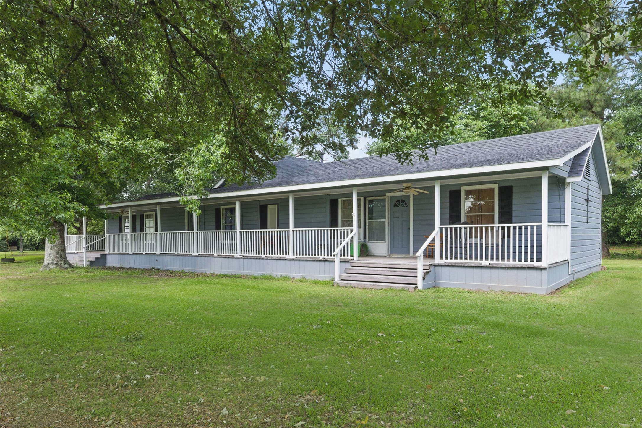 25371 Kickapoo Road Hockley, TX 77447 - Photo 2 of 46 a front view of a house with a garden