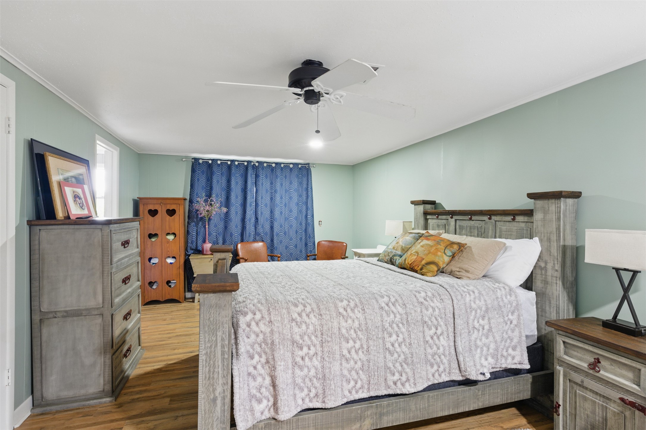 25371 Kickapoo Road Hockley, TX 77447 - Photo 26 of 46 a bedroom with a bed and wooden floor