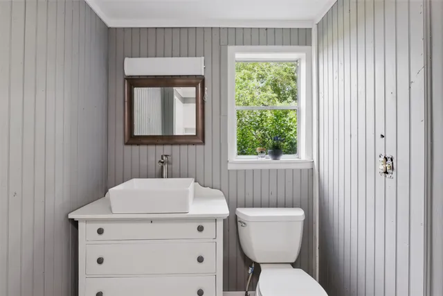 a view of a room with wooden floor and window
