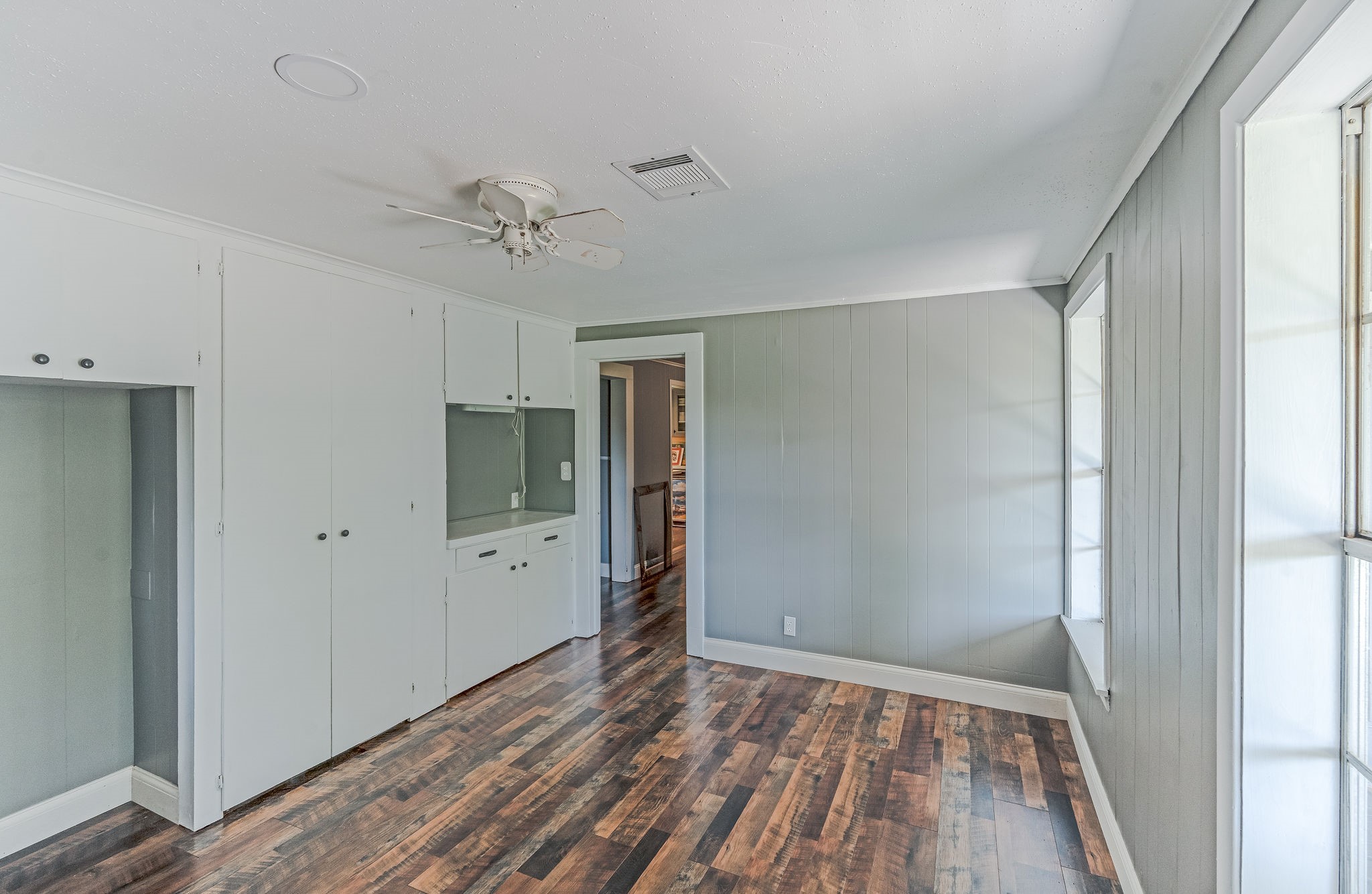 25371 Kickapoo Road Hockley, TX 77447 - Photo 30 of 46 a view of empty room with wooden floor and ceiling fan