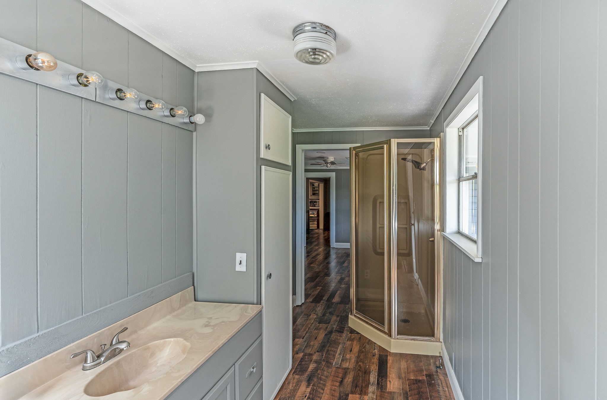 25371 Kickapoo Road Hockley, TX 77447 - Photo 32 of 46 a bathroom with a granite countertop sink a mirror and shower