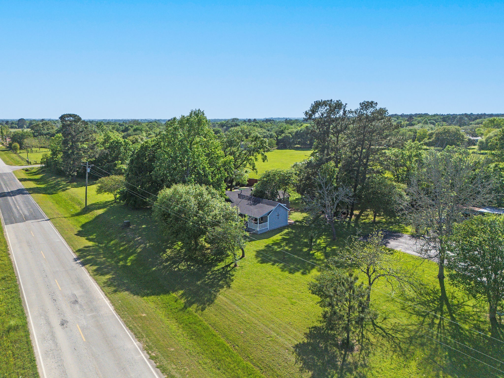 25371 Kickapoo Road Hockley, TX 77447 - Photo 34 of 46 a view of a lake with a yard