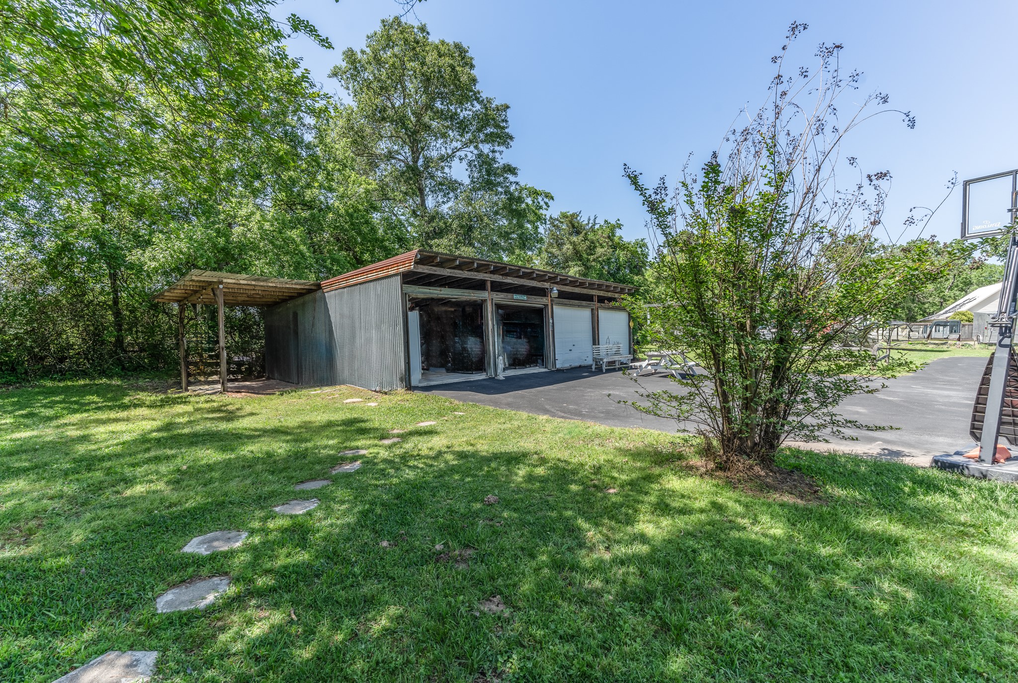 25371 Kickapoo Road Hockley, TX 77447 - Photo 40 of 46 a view of a house with backyard and a tree