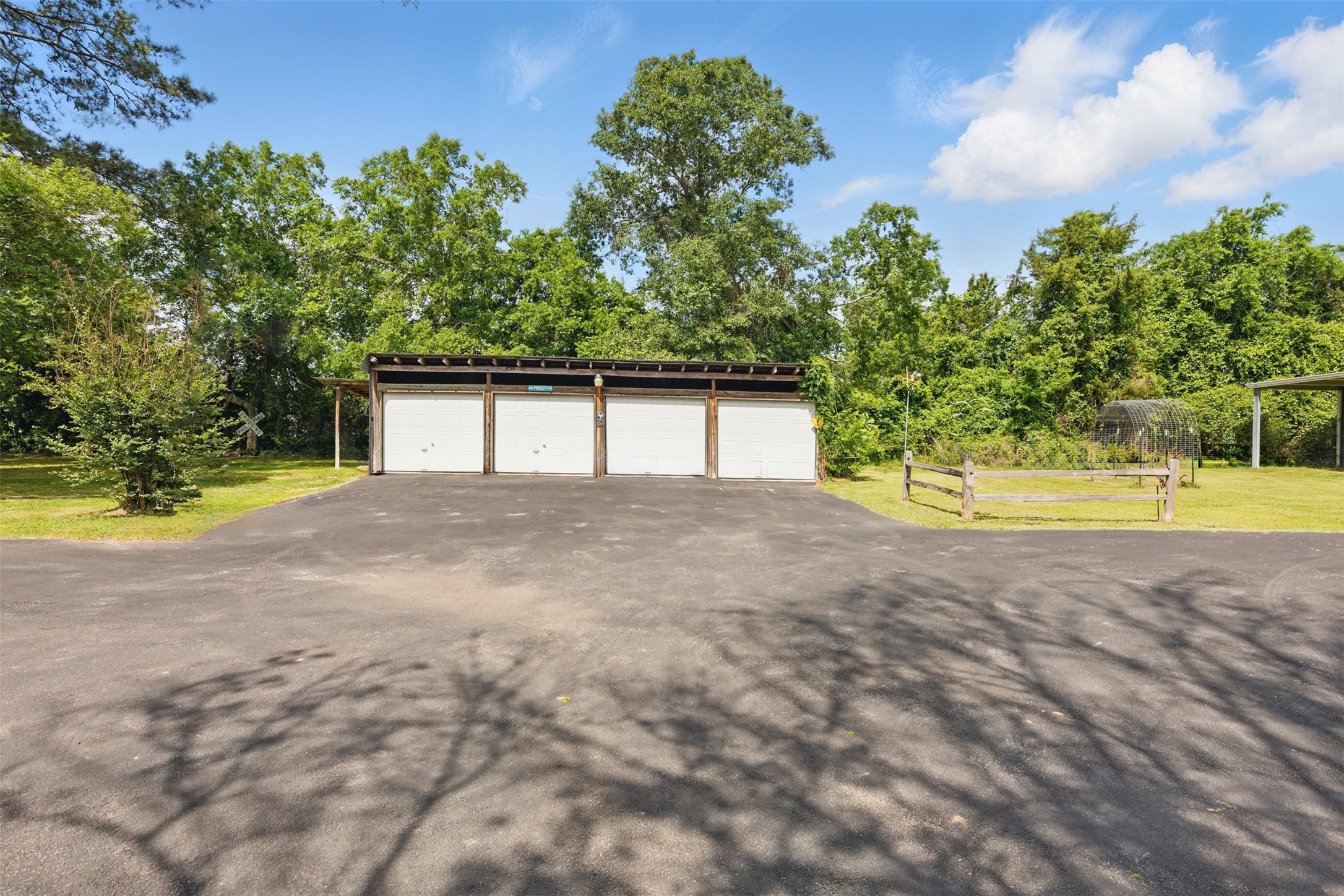 25371 Kickapoo Road Hockley, TX 77447 - Photo 43 of 46 a view of a house with a yard and a tree