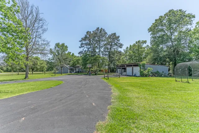 a front view of house with yard and outdoor seating