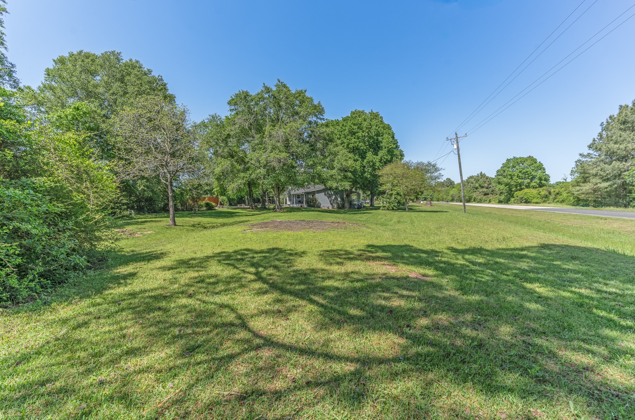 25371 Kickapoo Road Hockley, TX 77447 - Photo 45 of 46 a view of a green field with wooden fence