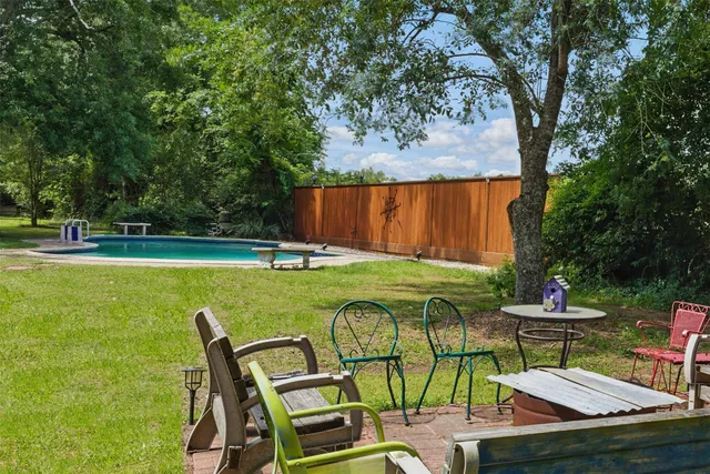a view of a swimming pool with a patio