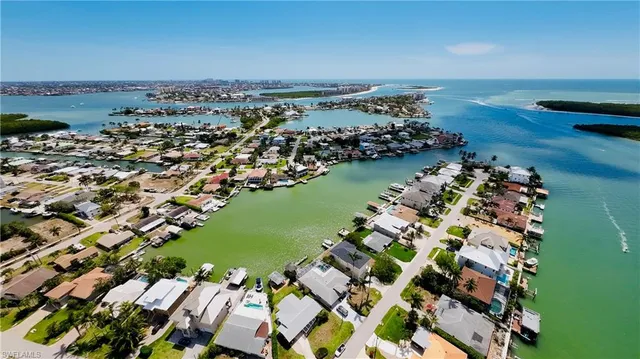 an aerial view of a house with a lake view