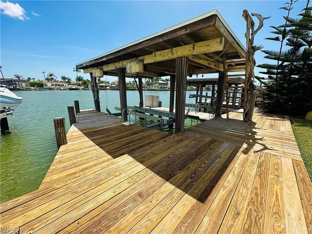 a view of a patio with a table and chairs