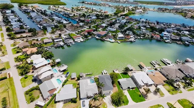 an aerial view of a house with a lake view