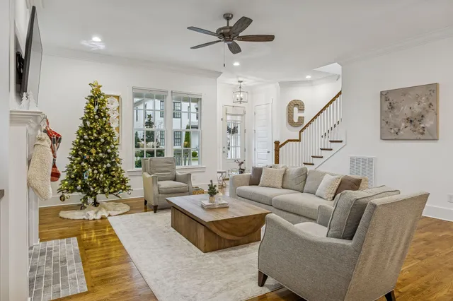 a view of a dining room with furniture wooden floor and a chandelier