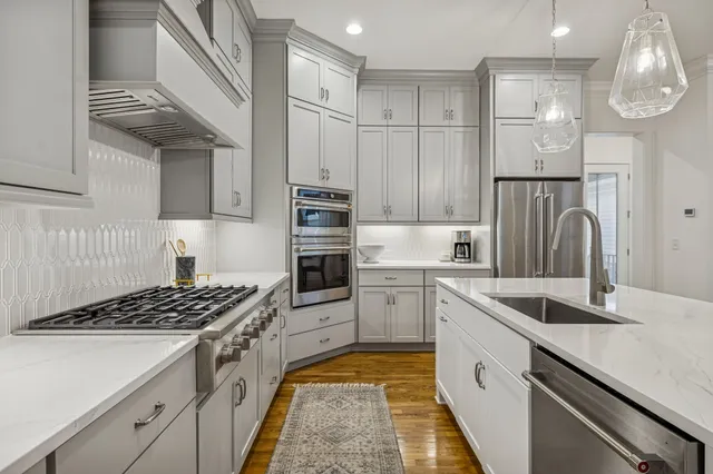 a view of a livingroom with furniture and a flat screen tv