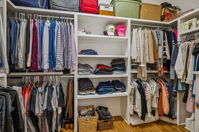 a view of a house with a couches and potted plant