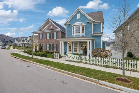 a wooden bench sitting in front of a building