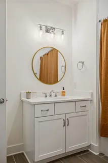 an aerial view of residential houses with outdoor space and lake view