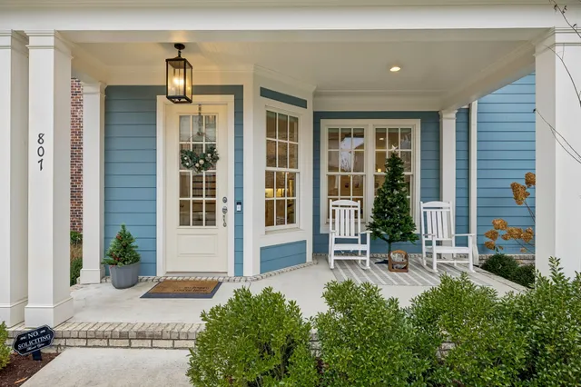a living room with fireplace furniture and a flat screen tv