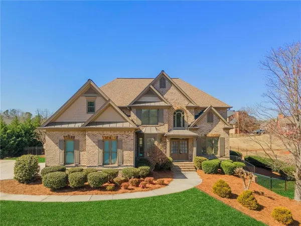 a front view of a house with a yard