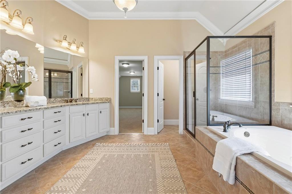 2602 Alcovy Club Drive Dacula, GA 30019 - Photo 19 of 44 a spacious bathroom with a double vanity sink mirror and double