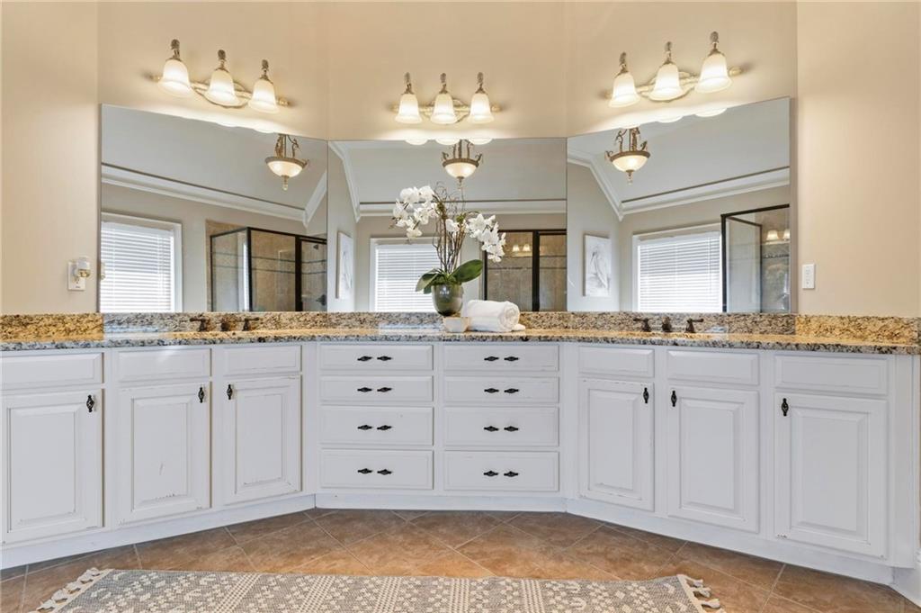 2602 Alcovy Club Drive Dacula, GA 30019 - Photo 21 of 44 a bathroom with a sink mirror and vanity